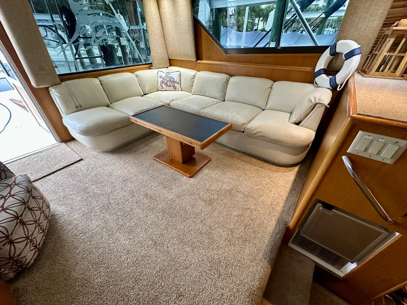 Slide: The Image of Luxurious interior of 1994 Hatteras 46 Convertible yacht with plush seating and elegant decor. - 75