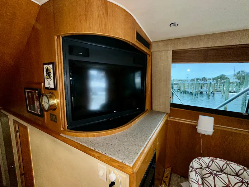 Slide: The Image of Interior of 1994 Hatteras 46 Convertible yacht with TV and window view. - 77