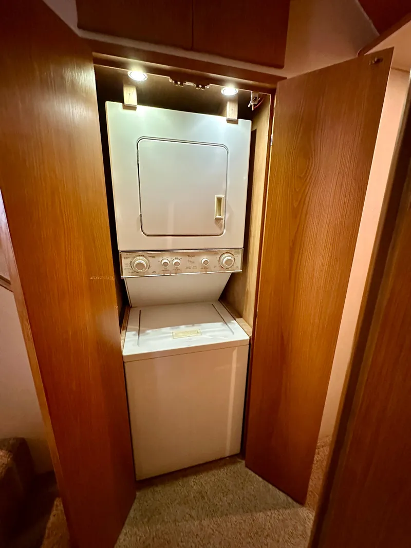 Slide: The Image of Stacked washer and dryer in 1994 Hatteras 46 Convertible yacht interior. - 97