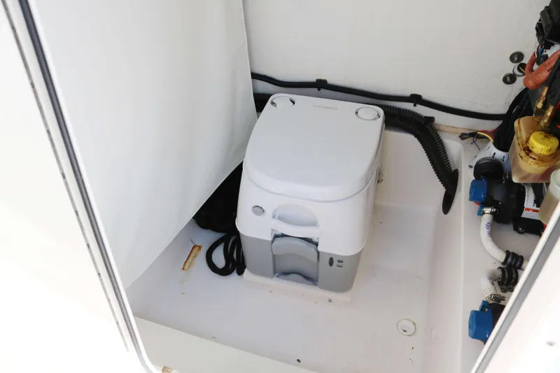 Slide: The Image of Portable toilet in 2022 Sea Born FX25 Bay boat interior. - 10