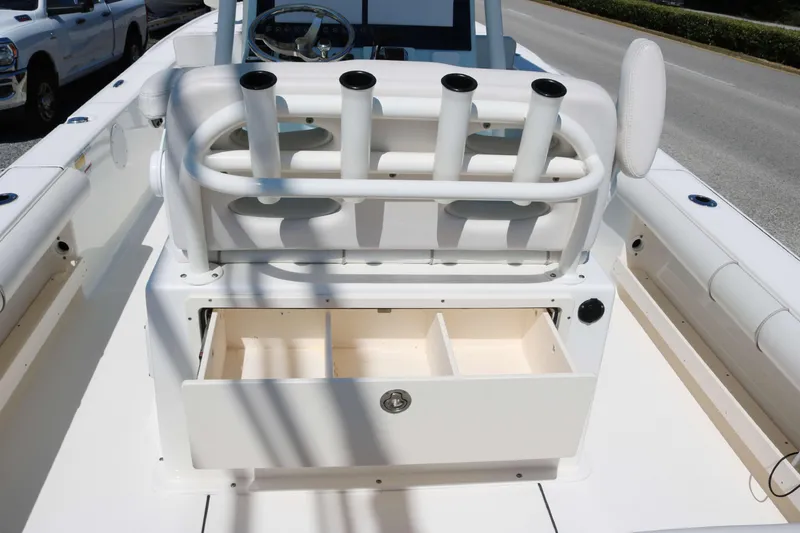 Slide: The Image of 2022 Sea Born FX25 Bay boat with rod holders and storage compartments. - 12