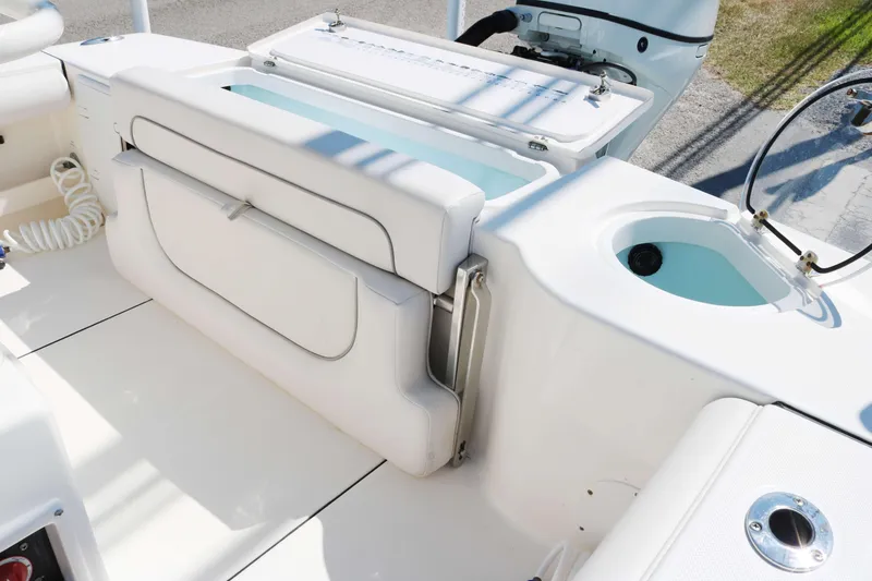 Slide: The Image of 2022 Sea Born FX25 Bay boat interior with seating and storage compartments. - 13