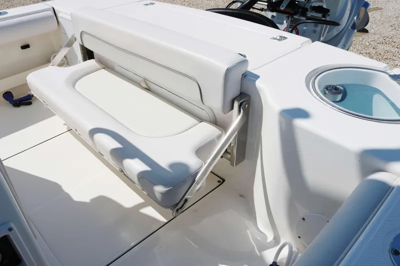 Slide: The Image of 2022 Sea Born FX25 Bay boat with foldable seating and sleek white interior design. - 14