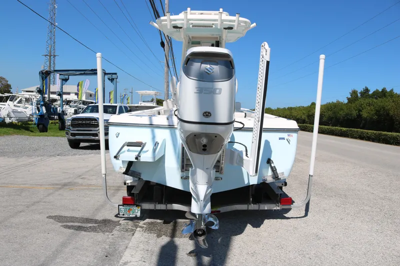 Slide: The Image of 2022 Sea Born FX25 Bay boat with powerful outboard motor on a trailer. - 5