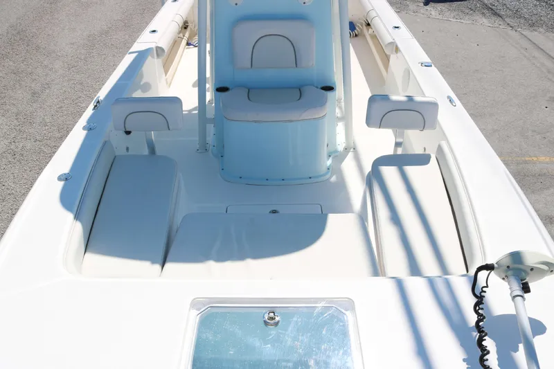 Slide: The Image of 2022 Sea Born FX25 Bay boat interior with seating and storage compartments. - 9