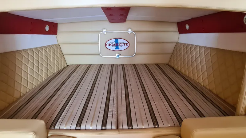 Slide: The Image of Interior cabin of a 2000 Cigarette Tiger 42 boat with striped upholstery. - 10