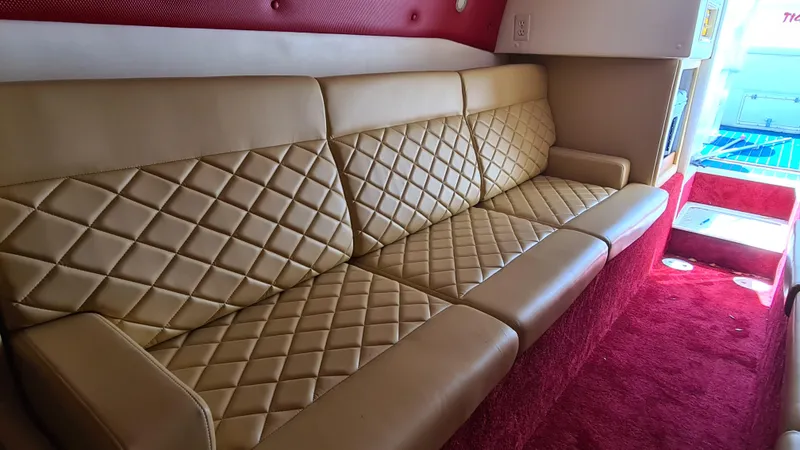 Slide: The Image of Luxurious beige leather seating in a 2000 Cigarette Tiger 42 boat interior. - 11