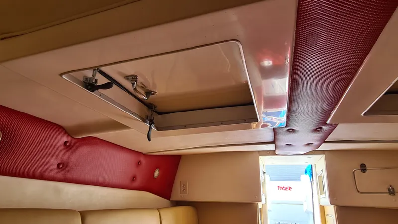 Slide: The Image of Interior of 2000 Cigarette Tiger 42 boat with red and beige upholstery. - 17