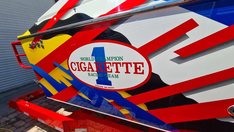 Slide: The Image of Colorful 2000 Cigarette Tiger 42 boat with bold racing graphics and logo. - 2