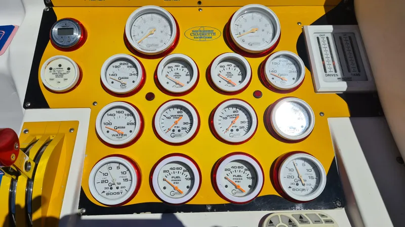 Slide: The Image of Dashboard of a 2000 Cigarette Tiger 42 boat with multiple gauges and controls. - 24