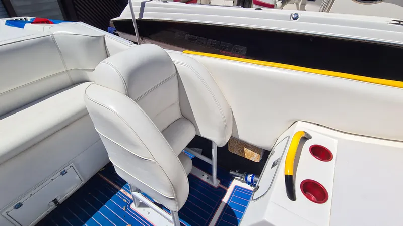 Slide: The Image of Cigarette Tiger 42 boat interior, white seating, blue flooring, cup holders, 2000 model. - 25