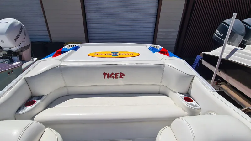 Slide: The Image of 2000 Cigarette Tiger 42 boat interior with white seating and colorful accents. - 27