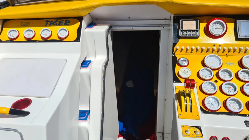 Slide: The Image of Control panel of a 2000 Cigarette Tiger 42 boat with gauges and switches. - 7