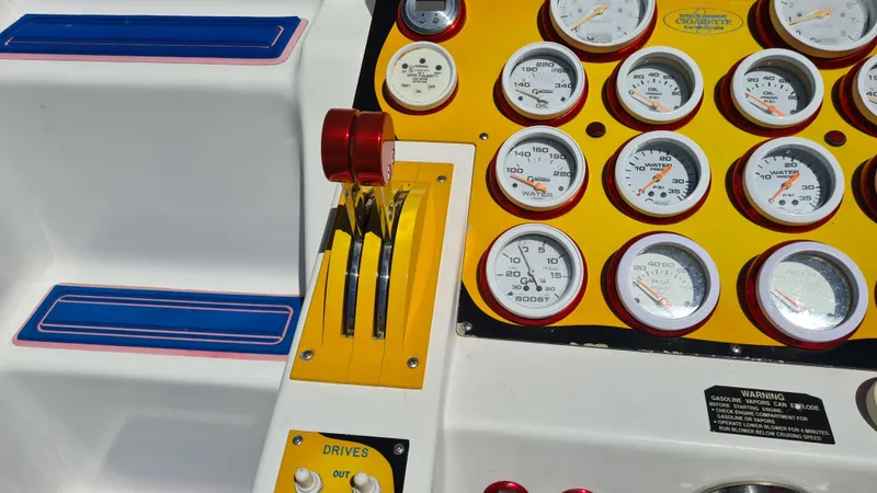 Slide: The Image of Control panel of a 2000 Cigarette Tiger 42 boat with gauges and throttle levers. - 8