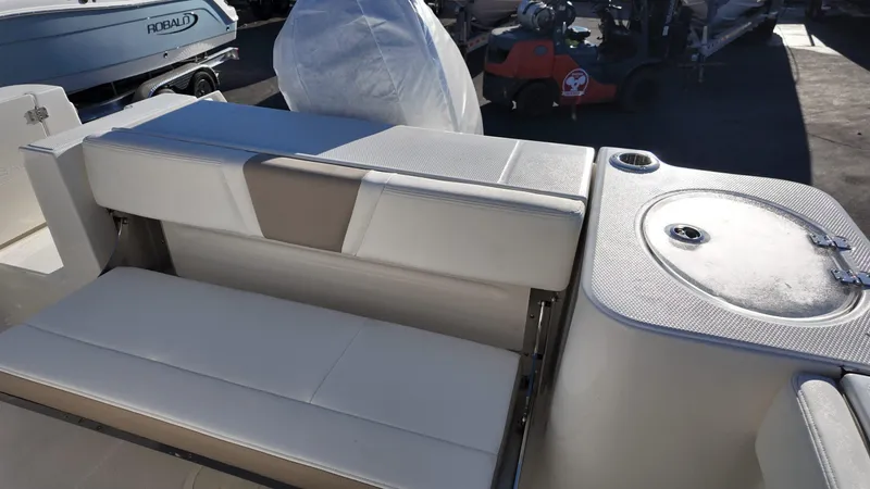 Slide: The Image of 2025 Robalo R230 boat interior with seating and storage area. - 8