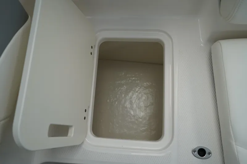 Slide: The Image of 2025 Chaparral 21 SSi OB boat interior seating, featuring sleek gray and white upholstery. - 12