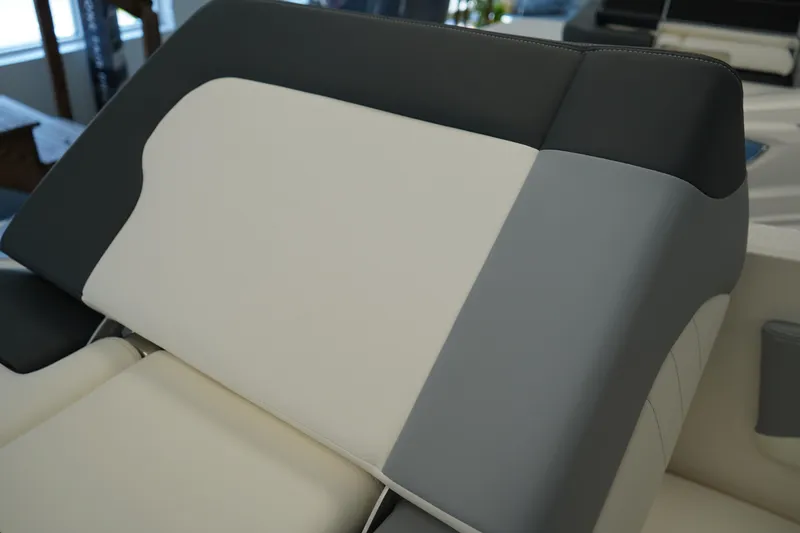 Slide: The Image of 2025 Chaparral 21 SSi OB boat interior with white and gray seating. - 17
