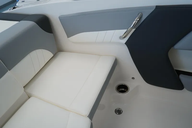 Slide: The Image of 2025 Chaparral 21 SSi OB boat interior with plush white seating and modern design. - 20