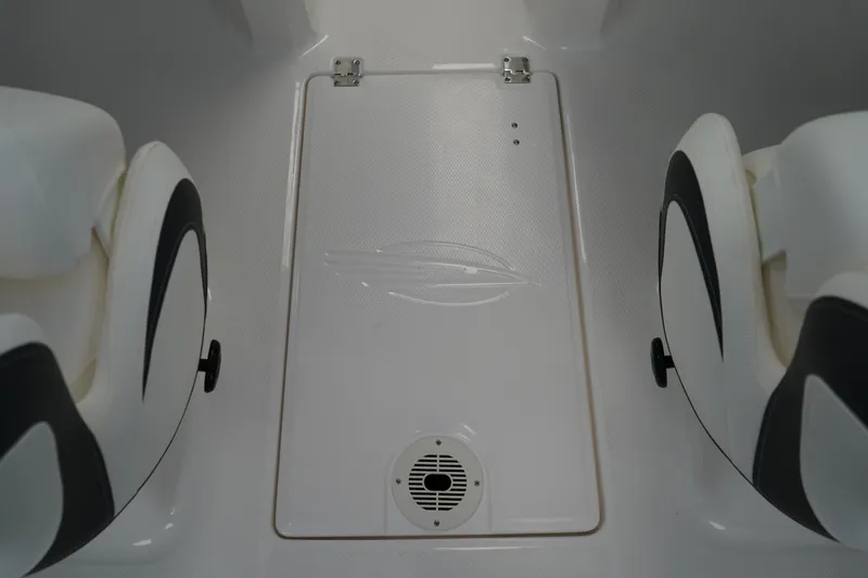 Slide: The Image of 2025 Chaparral 21 SSi OB boat interior with white cushioned seating. - 21
