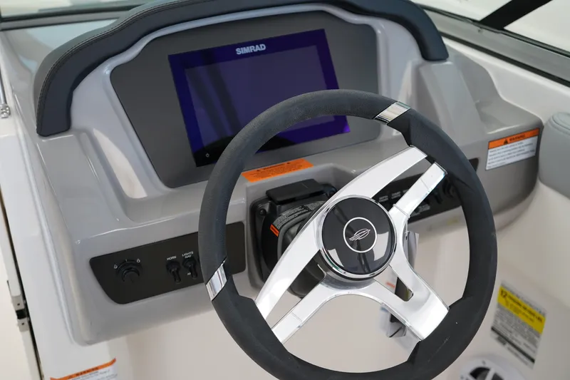 Slide: The Image of Control panel of 2025 Chaparral 21 SSi OB boat with warning label. - 29