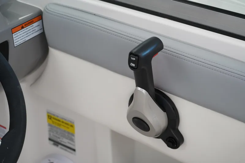 Slide: The Image of 2025 Chaparral 21 SSi OB boat interior with dual consoles in showroom. - 30