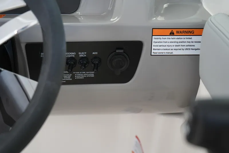 Slide: The Image of Storage compartment of 2025 Chaparral 21 SSi OB boat, featuring a sleek white interior. - 32