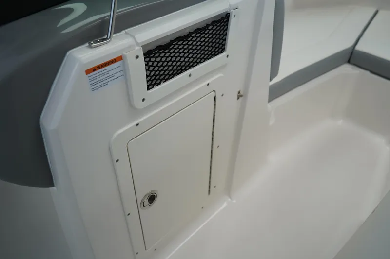 Slide: The Image of 2025 Chaparral 21 SSi OB boat interior with cushioned seating and speaker. - 34