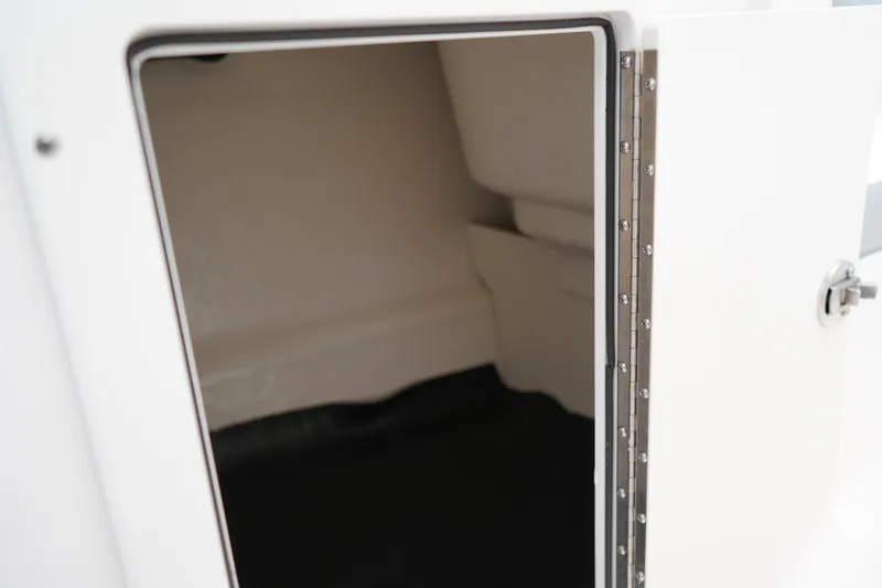 Slide: The Image of 2025 Chaparral 21 SSi OB boat interior with cushioned seating and speaker. - 35