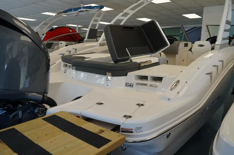 Slide: The Image of 2025 Chaparral 21 SSi OB boat interior with sleek seating and visible outboard motor. - 4