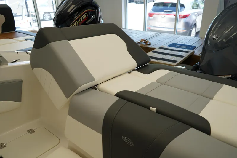 Slide: The Image of 2025 Chaparral 21 SSi OB boat storage compartment with white interior. - 8