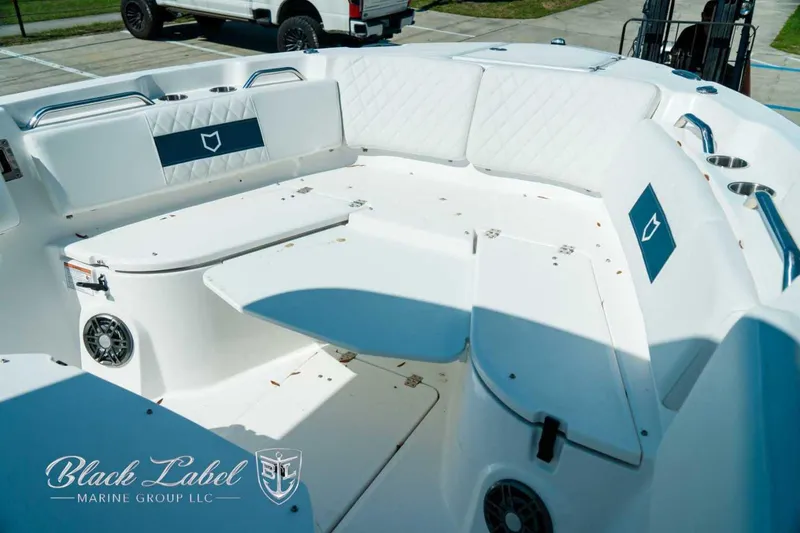 Slide: The Image of 2025 Sea Fox 268 Commander boat interior with white seating and cup holders. - 11