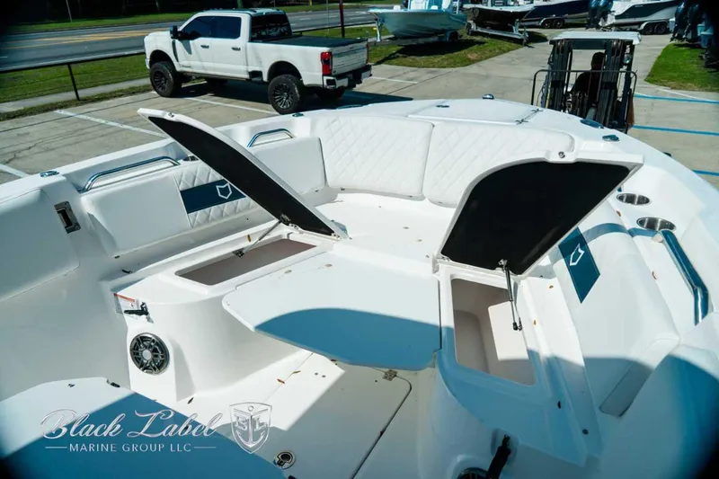 Slide: The Image of 2025 Sea Fox 268 Commander boat interior with open storage compartments and seating. - 12