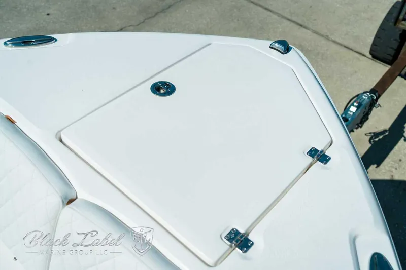 Slide: The Image of 2025 Sea Fox 268 Commander boat deck with storage hatch and sleek design. - 13
