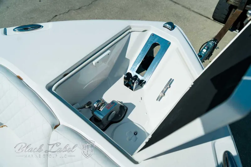 Slide: The Image of 2025 Sea Fox 268 Commander boat anchor compartment with winch and stainless steel fittings. - 15