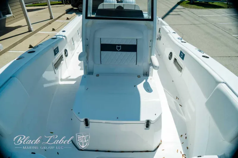 Slide: The Image of 2025 Sea Fox 268 Commander boat interior with seating and storage, displayed by Black Label Marine Group. - 16