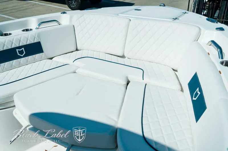 Slide: The Image of Luxurious seating on 2025 Sea Fox 268 Commander boat with white and blue accents. - 18