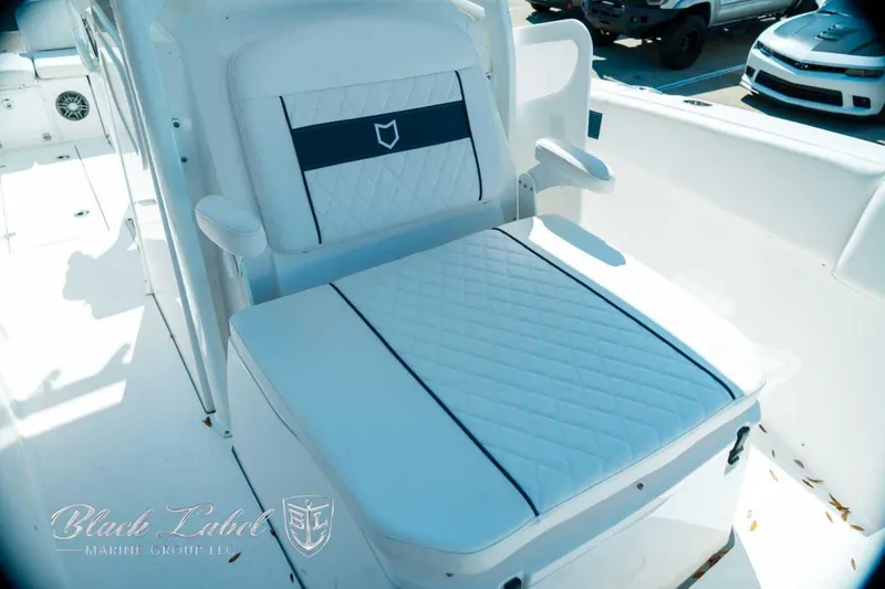 Slide: The Image of Luxurious seating on 2025 Sea Fox 268 Commander boat, featuring elegant white and black design. - 19