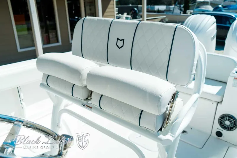 Slide: The Image of 2025 Sea Fox 268 Commander boat seating with elegant white upholstery and diamond stitching. - 21