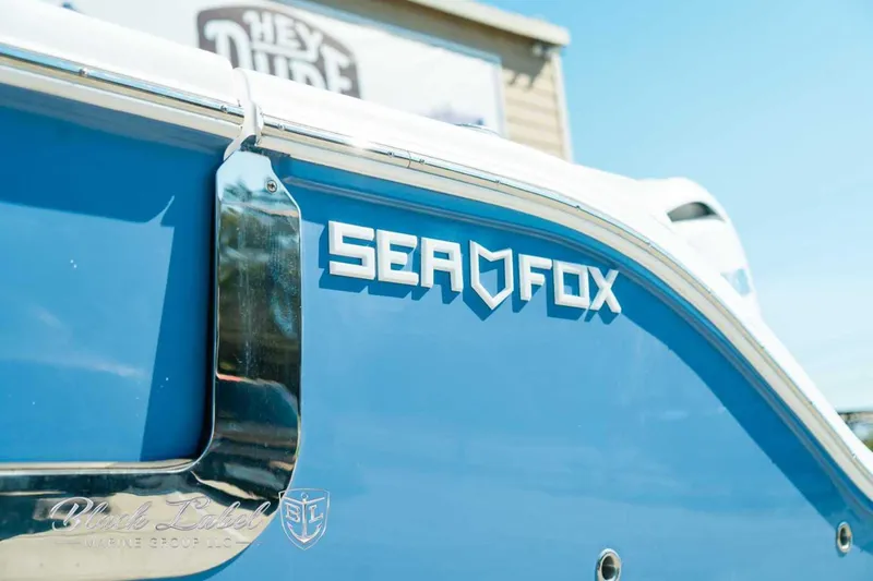 Slide: The Image of 2025 Sea Fox 268 Commander boat with blue hull and chrome details. - 3