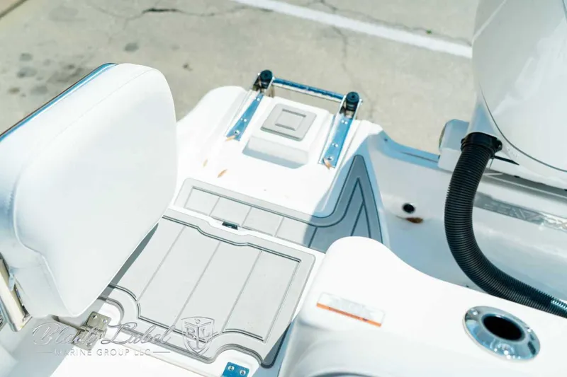 Slide: The Image of 2025 Sea Fox 268 Commander boat deck with seating and storage compartments. - 7