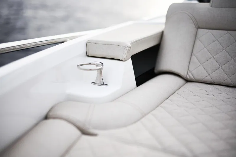 Slide: The Image of Luxurious interior of 2025 Skamander Sorrento boat with elegant seating and cup holder. - 12