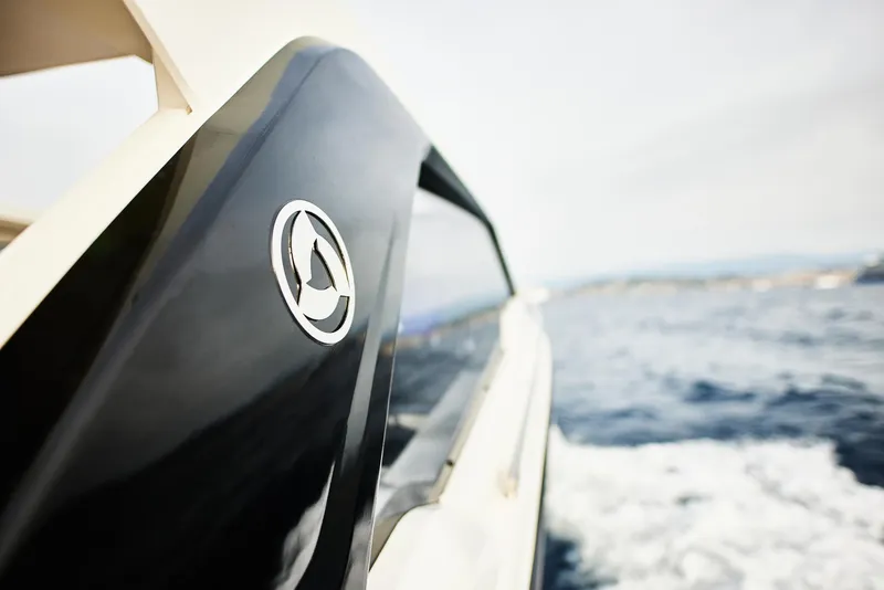 Slide: The Image of 2025 Skamander Sorrento yacht cruising on open water, showcasing sleek design and logo. - 20