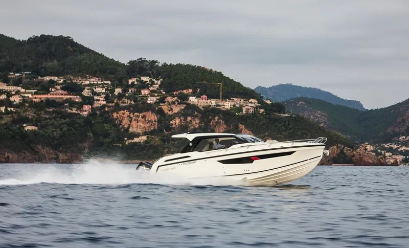 Slide: The Image of 2025 Skamander Sorrento boat cruising on scenic coastal waters. - 35