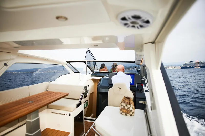 Slide: The Image of 2025 Skamander Sorrento yacht interior with passengers cruising on open water. - 5