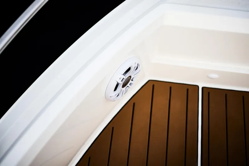 Slide: The Image of 2025 Skamander Sorrento boat deck with speaker and wood finish. - 9
