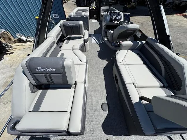 Slide: The Image of 2025 Barletta CORSA 25MA boat interior with luxurious seating and modern design. - 12