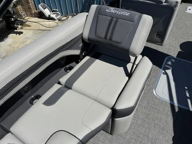 Slide: The Image of 2025 Barletta CORSA 25MA boat interior with luxurious gray seating and headrest. - 14