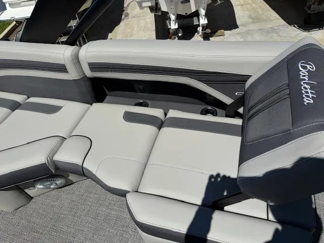 Slide: The Image of 2025 Barletta CORSA 25MA boat interior with sleek gray seating and cup holders. - 16