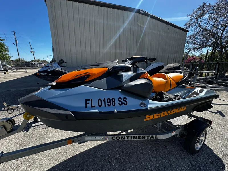 Slide: The Image of 2020 Sea-Doo GTI SE 130 jet ski on trailer, parked outdoors. - 10