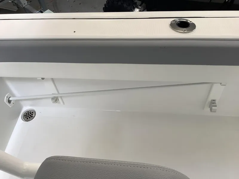 Slide: The Image of 2025 Release 210RX Center Console interior detail with rod holder and drain. - 17